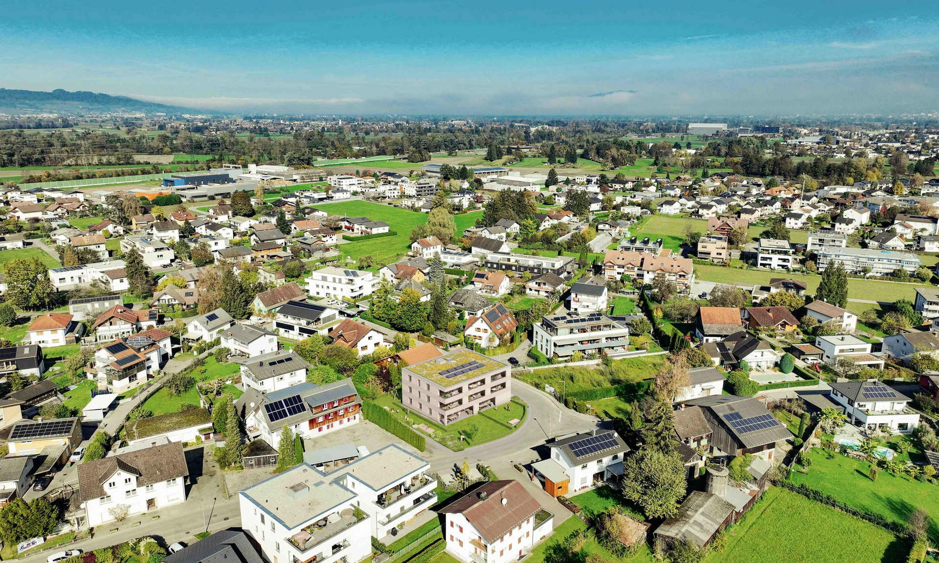 Visualisierung Luftbild eines geplanten Wohnprojekts von Wilhelm+Mayer in Vorarlberg.